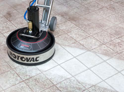 Person using a Rotovac to clean carpets with just one hand!
